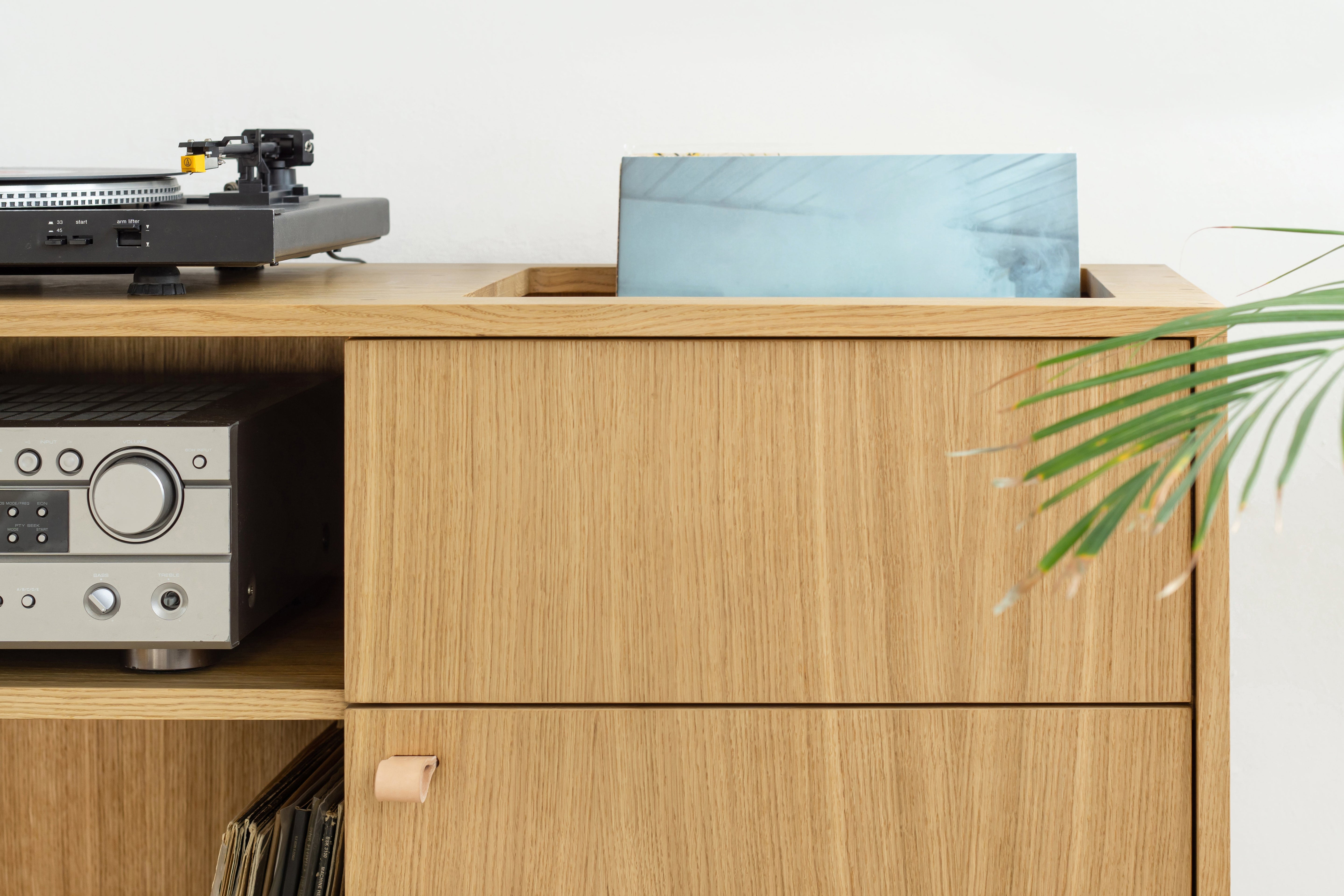 Handcrafted audio cabinet for turntable, Hifi amplifier, and vinyl collection storage.