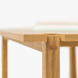 Handcrafted minimalist coffee table in Japandi style, made from solid wood with unique custom details, adding modern luxury and elegance to any living room detail of leg view