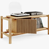 Solid wood record player cabinet with vinyl records shelf and a turntable and amplifier on a white background