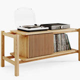 Wooden record player console with vinyl records turntable and amplifier on top shelf standing on a white background
