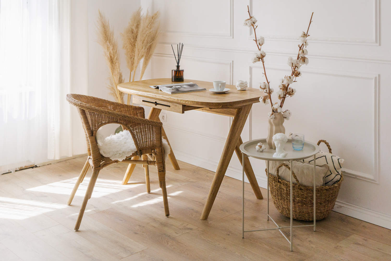 Premium kunsst desk made of solid wood wich can be used as  for makeup desk in bedroom or even wooden office desk, wooden desk with drawers with drawer under desk or solid oak desk for home office also known as writing desk. Front view of handmade furniture standing on wooden floor with the magazine on top and cup of coffee. 