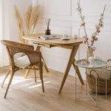 Premium kunsst desk made of solid wood wich can be used as  for makeup desk in bedroom or even wooden office desk, wooden desk with drawers with drawer under desk or solid oak desk for home office also known as writing desk. Front view of handmade furniture standing on wooden floor with the magazine on top and cup of coffee. 