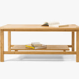 Minimalist handcrafted coffee table made from solid wood, Japandi-inspired design with custom details, perfect for modern living room interiors and contemporary elegance. Front view 
