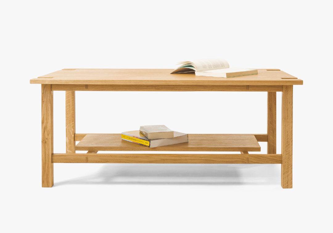 Minimalist handcrafted coffee table made from solid wood, Japandi-inspired design with custom details, perfect for modern living room interiors and contemporary elegance. Front view 