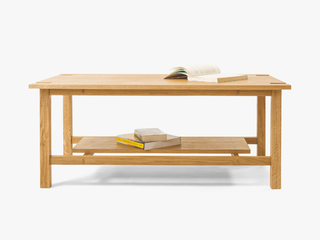 Minimalist handcrafted coffee table made from solid wood, Japandi-inspired design with custom details, perfect for modern living room interiors and contemporary elegance. Front view 