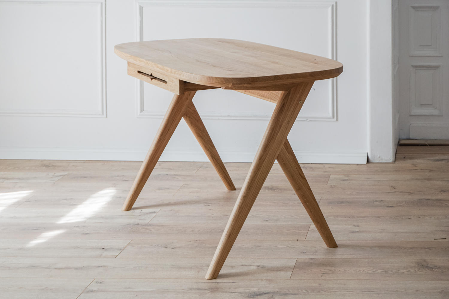 Kunsst wooden writing desk can successfully be used as  for makeup desk in bedroom or even wooden office desk, wooden desk with drawers with drawer under desk or solid oak desk for home office angled view.