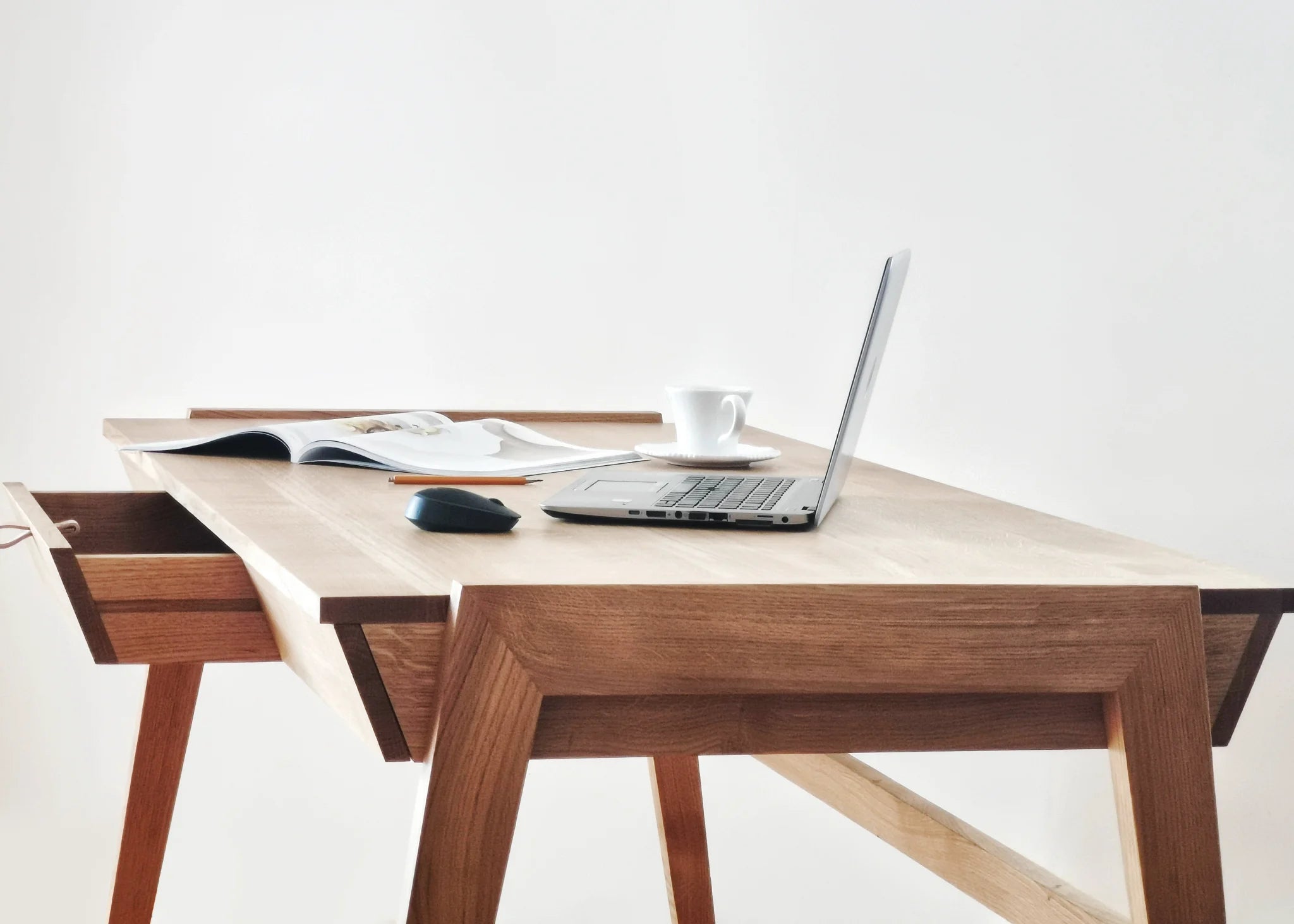 Premium solid wood home office desk with a laptop, mouse, and coffee cup on a white background