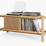 Wooden record player stand with vinyl records storage on a white background