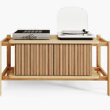 Wooden audio cabinet with turntablea and amplifier on a white background