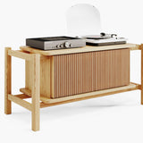 Side view of a solid oak record player cabinet showing overall proportions and leg design